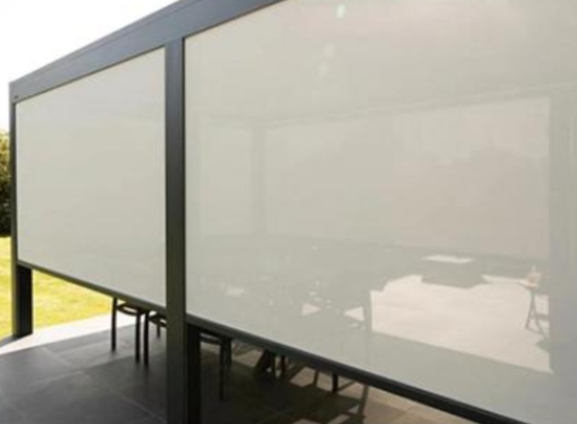 Motorized retractable screens on pergola